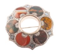 A silver and specimen agate brooch, shaped circular outline,