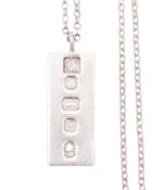 An Elizabeth II silver ingot pendant & chain, by Ralph Weston, Sheffield 1977; the ingot 1.75