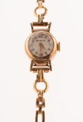 Helvetia a lady's 9K gold wristwatch the round cream dial signed Helvetia with raised gilt baton