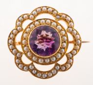 An antique amethyst and seed pearl brooch, possibly late Victorian/early 20th century,