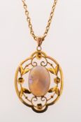 An Edwardian opal pendant with chain,