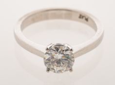 A diamond solitaire ring, a modern four claw setting, set with a brilliant-cut diamond,