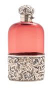 A late Victorian silver gilt mounted red glass spirit flask, oval form,