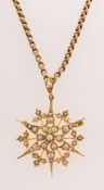 A Victorian pearl starburst pendant brooch with chain,