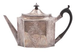 A George III silver tea pot, of shaped octagonal form, with bright engraved decoration,