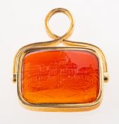 An antique carnelian intaglio swivel fob pendant, carved depicting St.