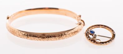 An antique 9ct gold bangle and a brooch, a Victorian 9ct gold bangle,