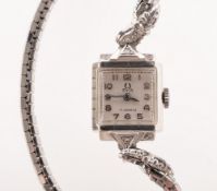 Birks a 14K gold wristwatch the dial signed Titus, 17 Jewels and having raised Arabic numerals,