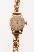 Roamer a lady's 9K gold wristwatch, the round cream dial having raised baton numerals,