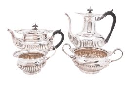 A late Victorian four-piece silver tea & coffee service, circular baluster form,