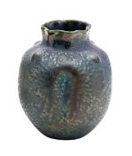 Two Heliosine Austrian iridescent pottery vases, one of wrythen form with twin handles and oval rim,