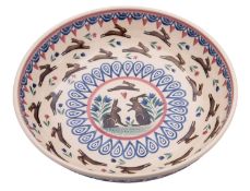 A Bell Pottery spongeware 'leaping hare' bowl decorated with bands of hares and flowers within a
