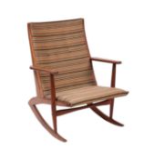A teak and upholstered boomerang rocking chair by Georg Jensen, mid 20th Century.