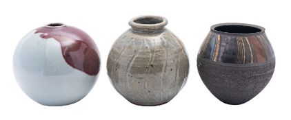 Three studio pottery vases comprising a grogged stone vase by John Wheeldon,