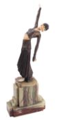 A Continental Art Deco cold painted metal and ivory mounted model of a dancing girl,