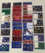 A collection of thirty nine plastic cased coin sets from Great Britain, including some silver etc.