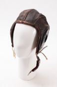 A WWII US leather flying helmet. Serial number AN6540-3L, size large.