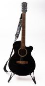 A Stagg model SW206CEBK acoustic guitar.