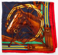 A Ralph Lauren equine scarf, having a horse head on a blue ground with red border, 91cm, 85cm.
