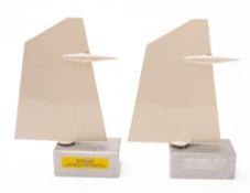 A pair of bookends in the form of vertical tailfins.