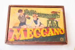 A collection of loose Meccano, various sets and colours, including wheel , gears and braces in red,