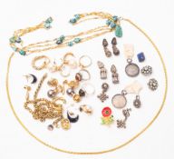 A mixed collection of silver and yellow metal costume jewellery.