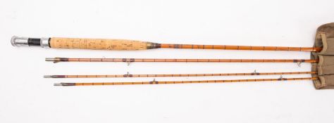 A Hardy Bros, Alnwick 'Gold Medal' three piece fly fishing rod. With spare tip and in cloth bag.