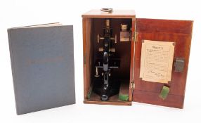 An early 20th century lacquered brass microscope, circa 1929, No .