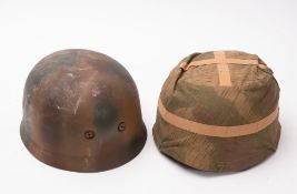 A reproduction German army Paratrooper helmet.