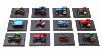 A large collection of static diecast models of tractors.