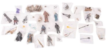 A collection of Star Wars figures and accessories.