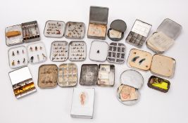 A mixed collection of fly fishing ties. In a range of metal tins etc.