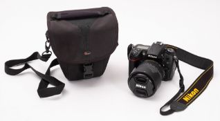 A Nikon D7000 DSLR camera outfit.