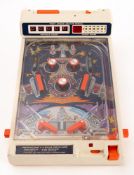 A Tomy Atomic Flipper battery operated pinball machine. In original box.