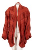 A group of four lady's jackets, including a Finity Studio brown and yellow stripped silk jacket,