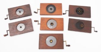 Seven astronomy related rack and pinion magic lantern slides.