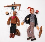 Two early 20th Century Toad of Toad Hall puppets.