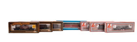 A collection of OO/HO gauge goods wagons.