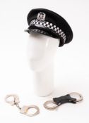 A Hampshire police cap and two sets of handcuffs.