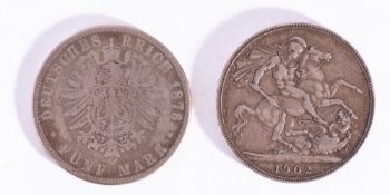 A 1902 Crown coin together with an 1876 German five Mark.