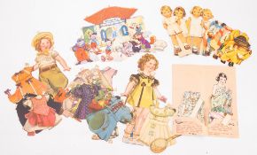 A collection of Disney and other paper dolls and cut outs,