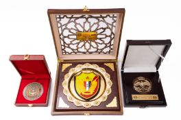 A group of Qatar Armed Forces Defence Attaché gilt and enamel presentation plaques and similar