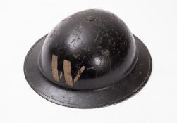 A British WWII Air Raid Warden's helmet, of steel construction, painted black with white lettering,