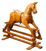 A mid 20th Century John Mellor Scott wooden rocking horse.
