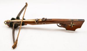 A 19th Century Continental walnut and bone inlaid crossbow.