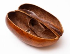 Coco du Mer (Lodoicea) cut to make a two division basket, 29cm long.