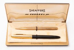 A 9ct gold propelling pencil together with a Sheaffer fountain pen.