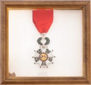 A Legion d'honeur medal. Mounted in a wooden frame and glazed, 15cm, 16cm.