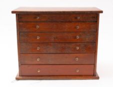 An early 20th Century oak collectors' chest.