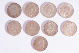 A group of nine higher grade shilling coins.